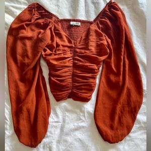 Rust orange long sleeve top